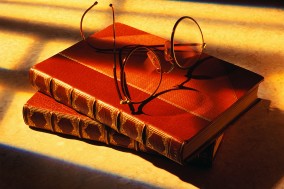 Eyeglasses atop Books