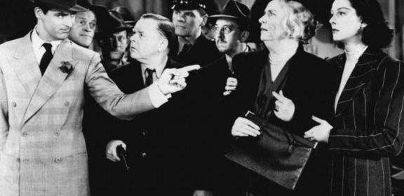From left, Cary Grant, Frank Jenks, Roscoe Karns, Gene Lockhart, Pat Flaherty, Porter Hall, Alma Kruger & Rosalind Russell in "His Girl Friday"